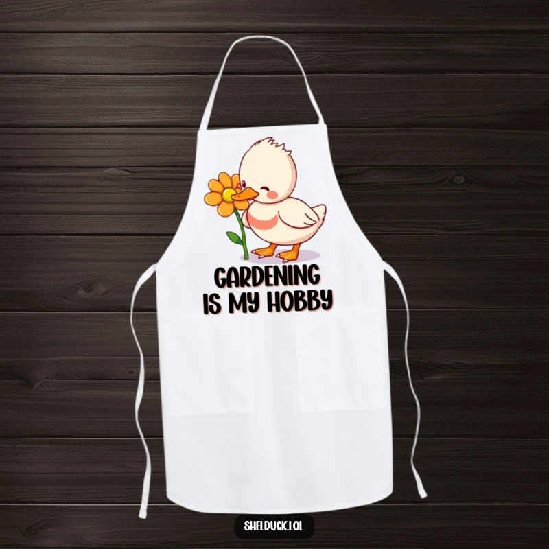 Funny Shelduck Apron: A playful shelduck bird pecking at a flower, designed for kitchen fun and protection, adding humor to cooking.