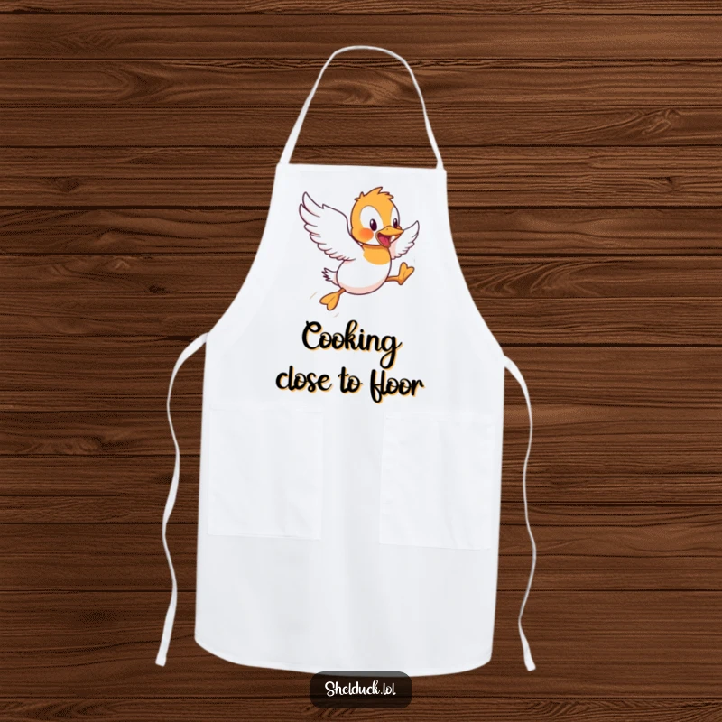 Funny Shelduck Apron: A humorous depiction of a shelduck bird attempting short flight hops, perfect for kitchen protection and laughs.