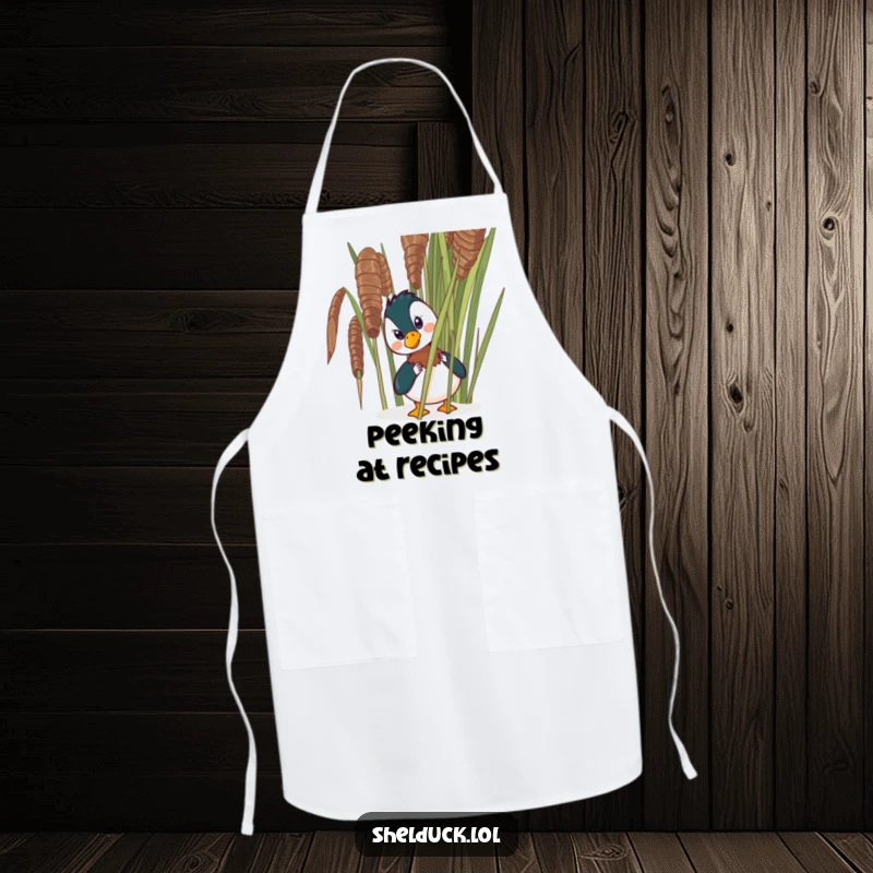Funny shelduck apron designed with a comical bird peeking from behind a reed, bringing humor to kitchen activities.