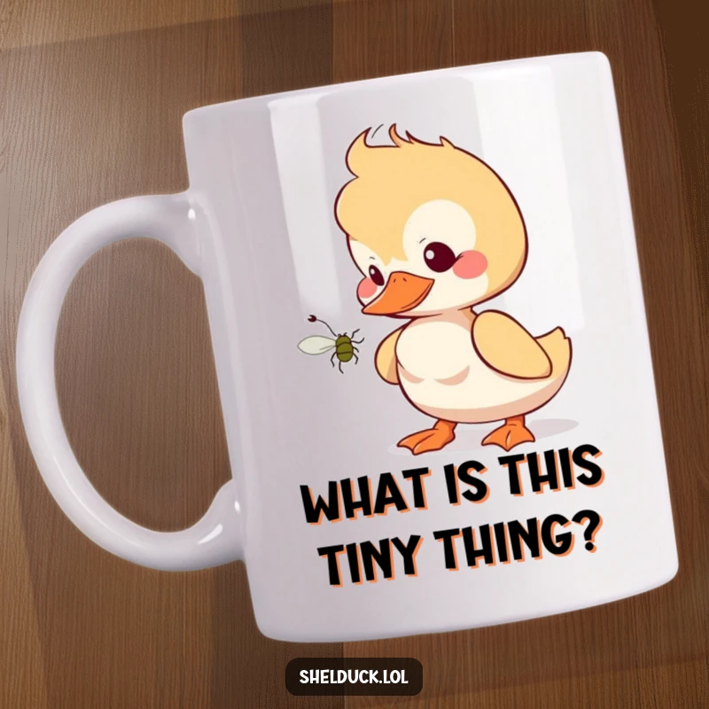 Funny shelduck mug with a tilted head, looking curiously at a small bug, illustrating inquisitive and humorous bird behavior.