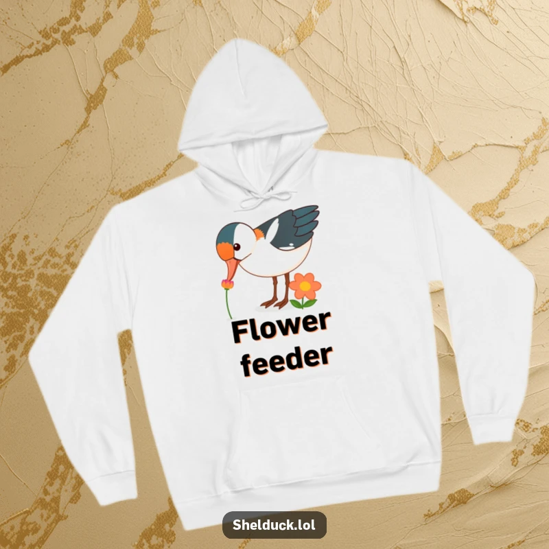Funny shelduck bird hoodie, curiously pecking at a brightly colored flower, cozy, warm, perfect funny gift.