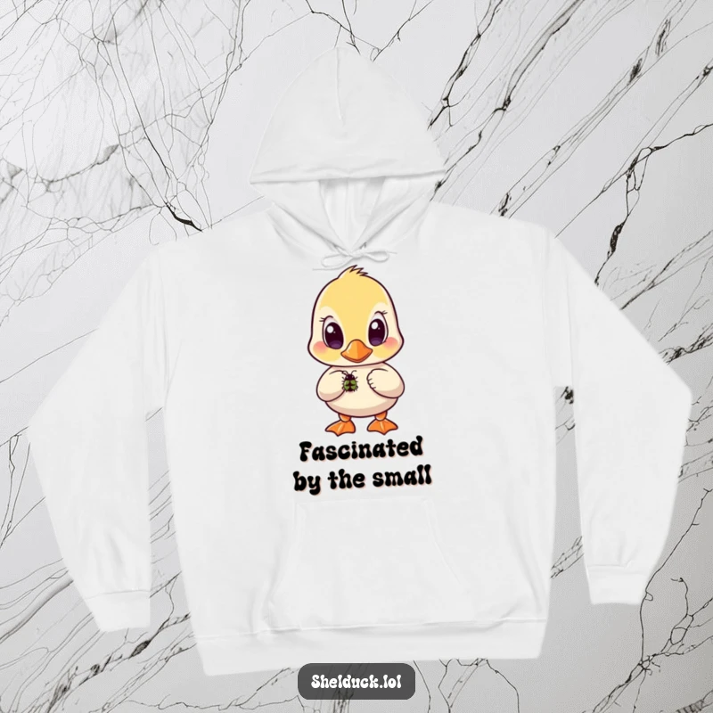 Funny shelduck hoodie depicting a bird with wide, curious eyes fixated on a small insect below.