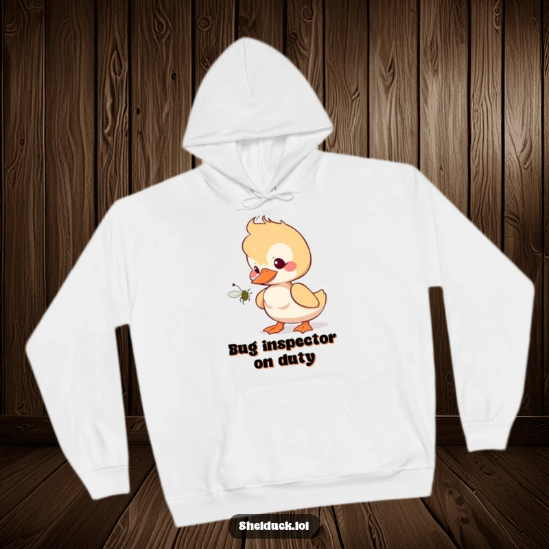 Funny shelduck hoodie featuring a bird tilting head curiously at a bug, designed for comfort and humorous appeal.