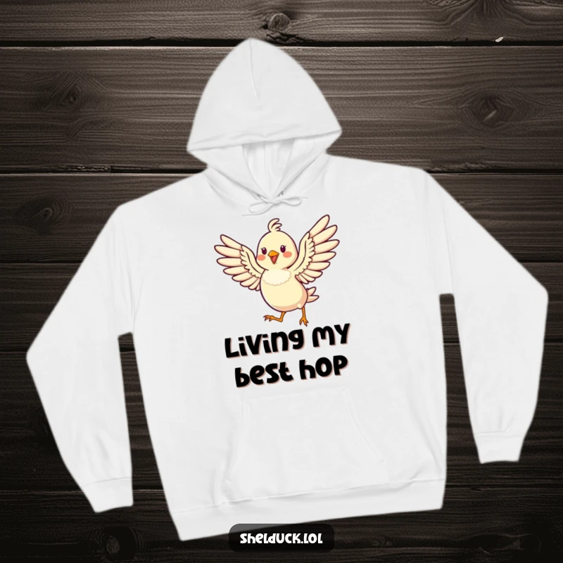 Funny hoodie showcasing a cheerful bird hopping high with its wings spread wide, symbolizing pure joy and exuberance.