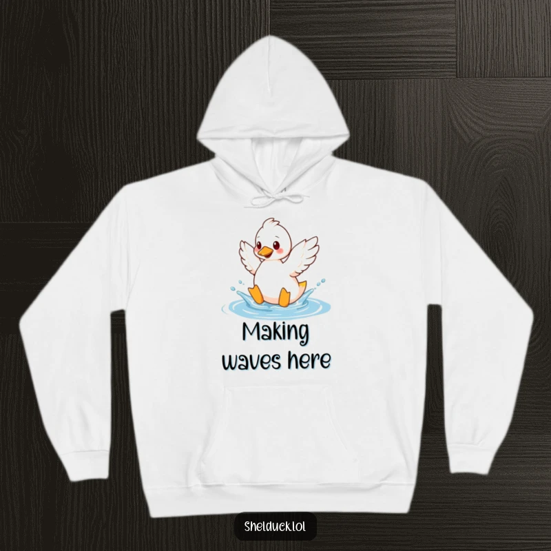 Funny shelduck hoodie depicting a bird playfully splashing water with its wings, perfect for cozy, fun wear.