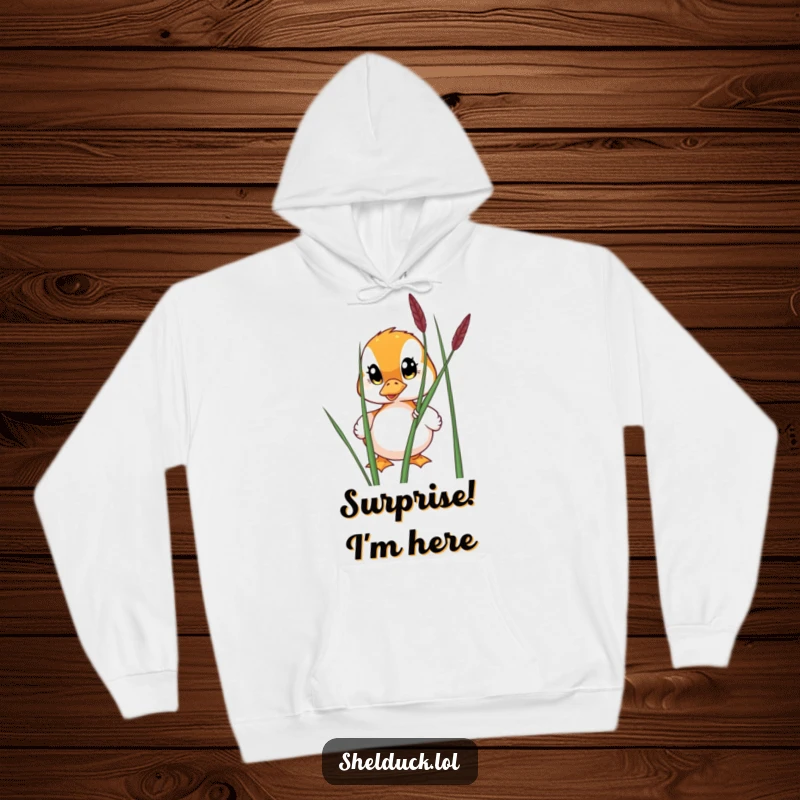 Funny hoodie featuring a shelduck with wide eyes peeking from behind a reed, embodying cozy curiosity and gentle observation.