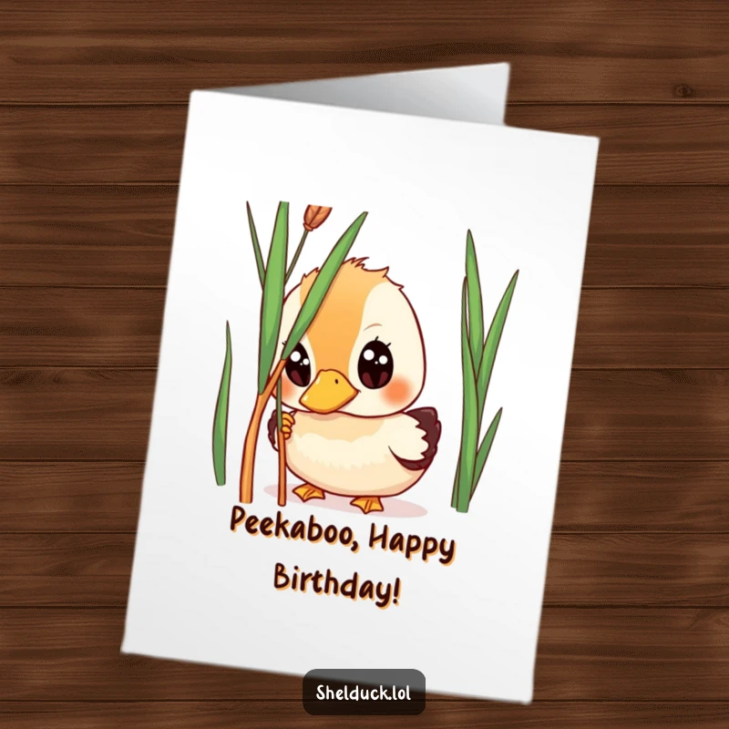 Funny Free Printable Shelduck Birthday Card: A shelduck with wide, curious eyes peeking playfully from behind a tall reed.