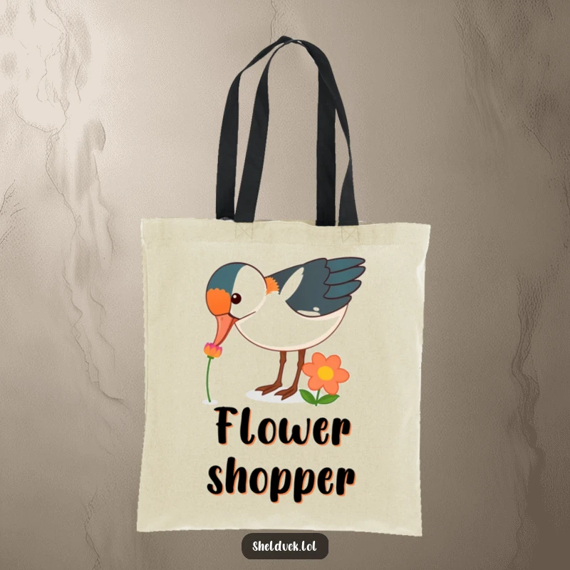 Funny shelduck bird tote bag, curiously pecking at a brightly colored flower, floral accessory, unique funny gift.