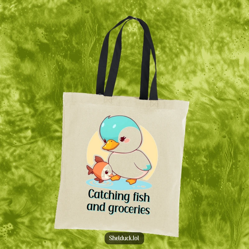 Funny Shelduck Tote Bag showcasing a cute duck character curiously observing a small fish, perfect for carrying essentials.